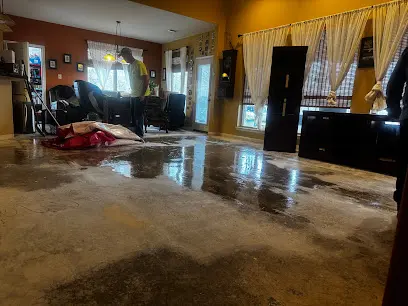 A Clayton County, Forest Park, GA home interior with standing water and drying equipment